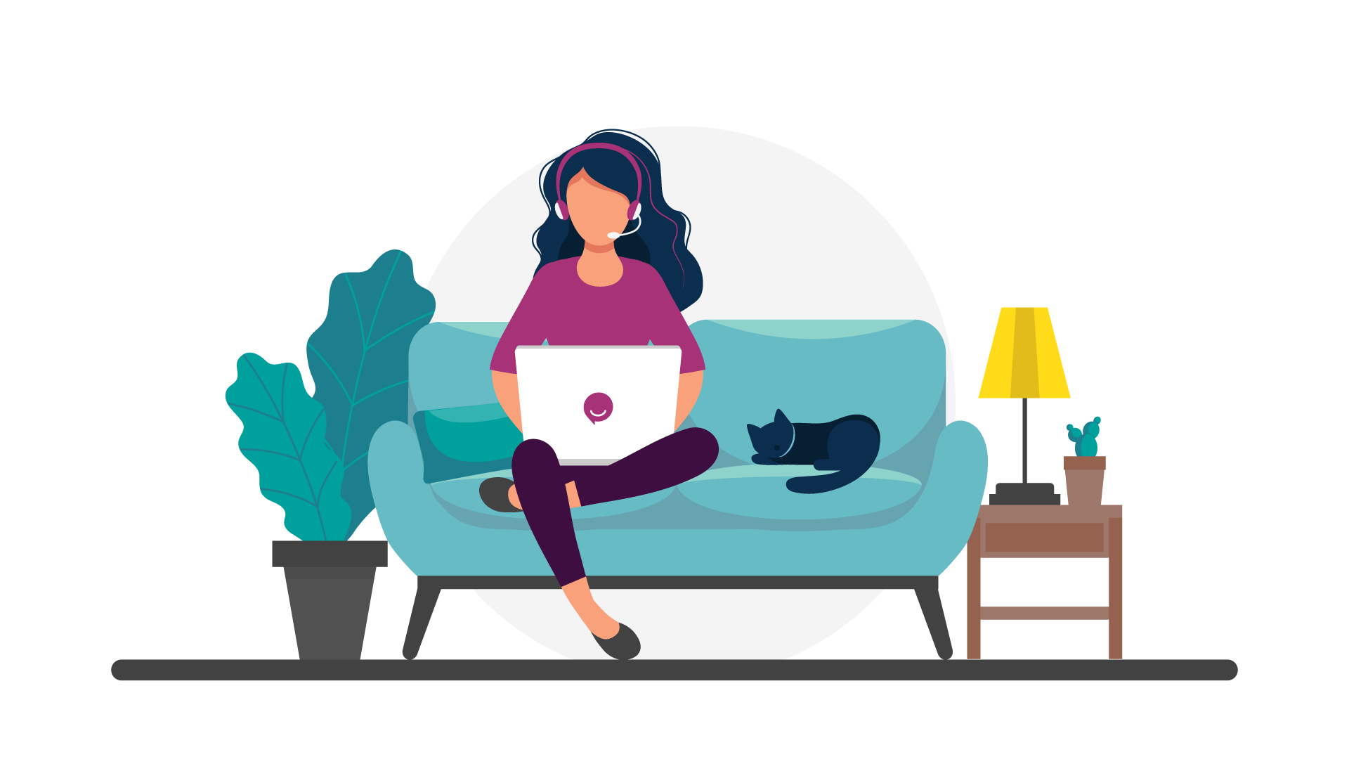 A woman sits on a couch with a laptop and a cat.